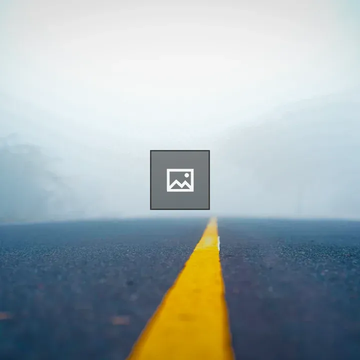 Deserted Foggy Road with Yellow Centerline