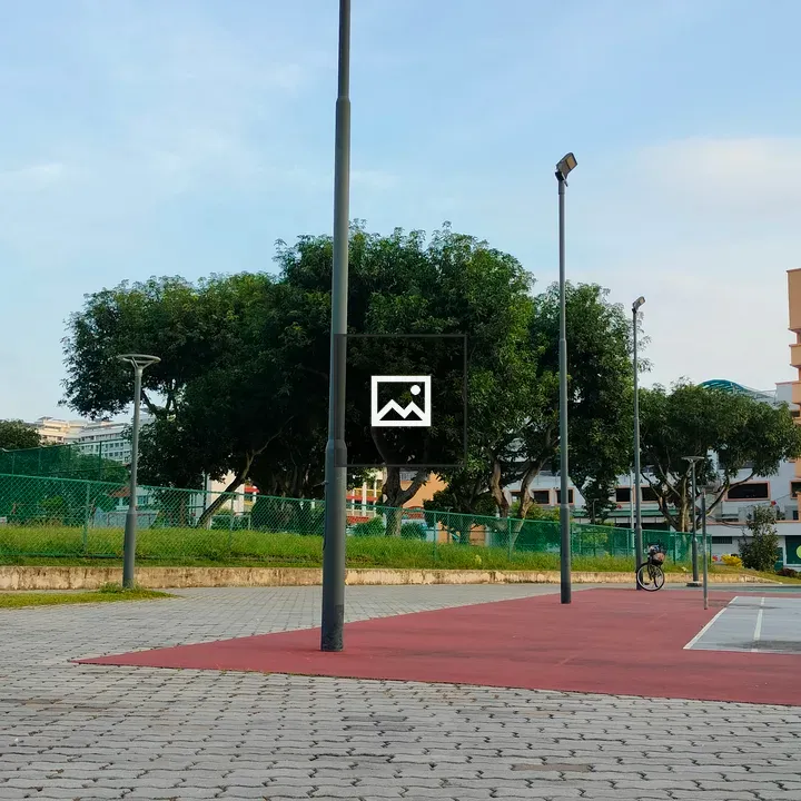 Urban corner with streetlights and cyclist