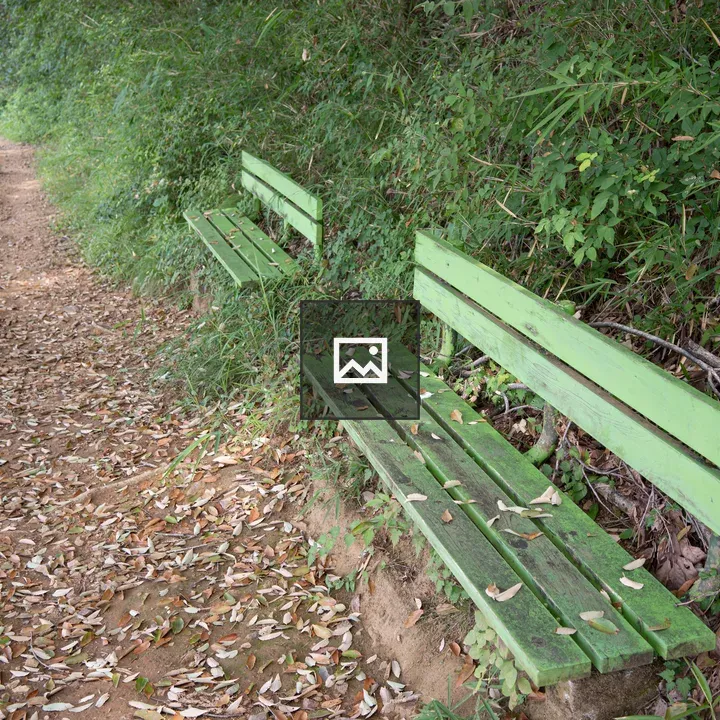 Green bench in the mountains