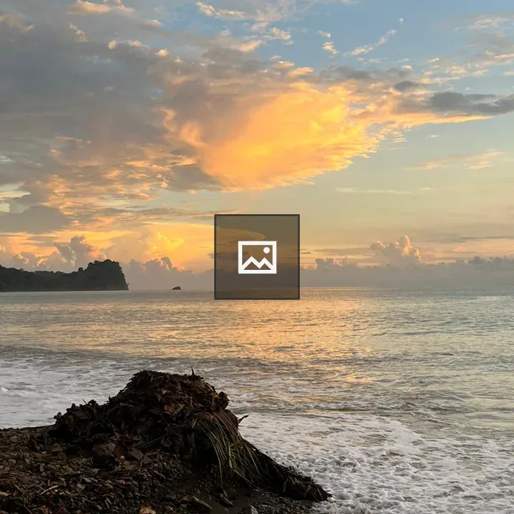 Golden sunset over rocky shoreline