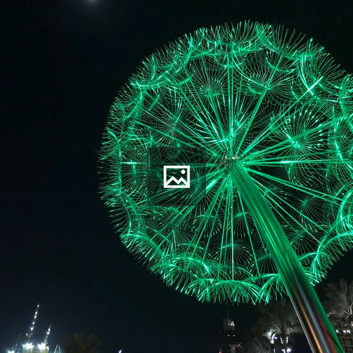 Dandelion-like sculpture under green light