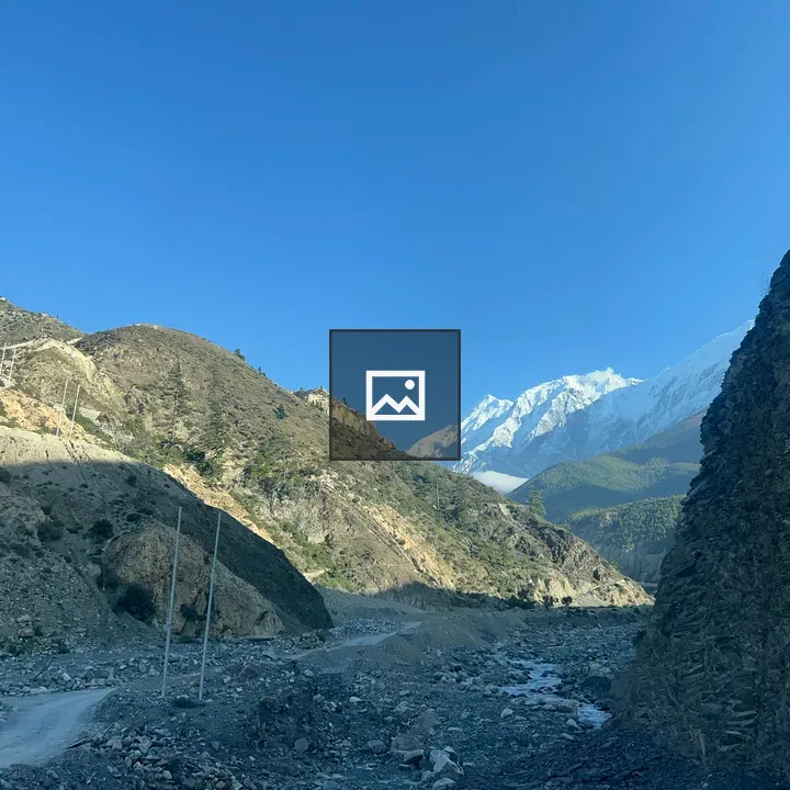 Snow-capped Peak Over Valleys