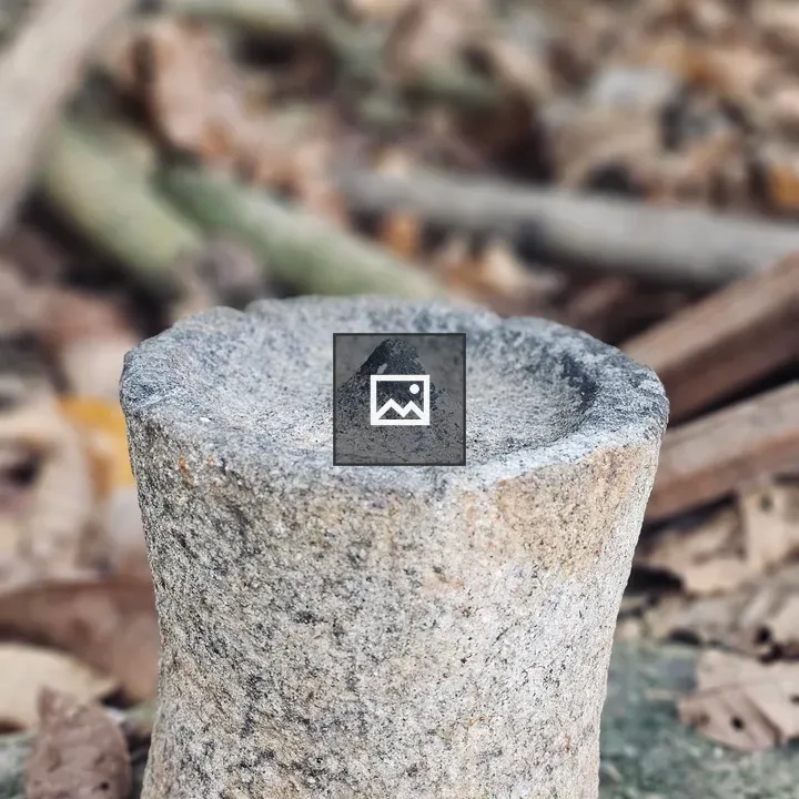 Stone oil lamp in rural setting