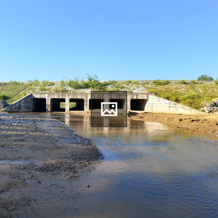 Concrete arched bridge over river