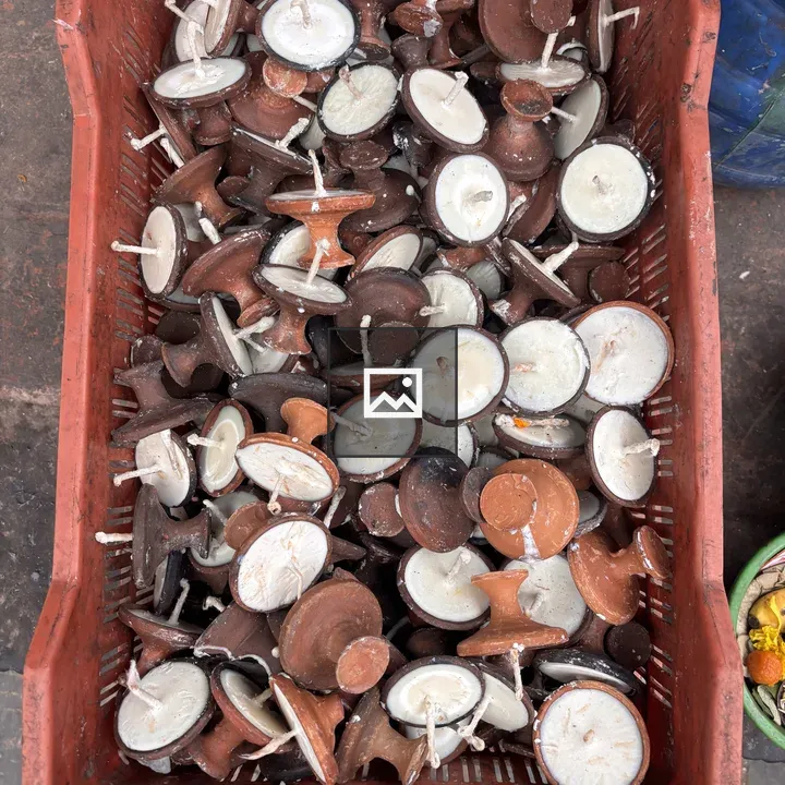 Basket of traditional clay oil lamps