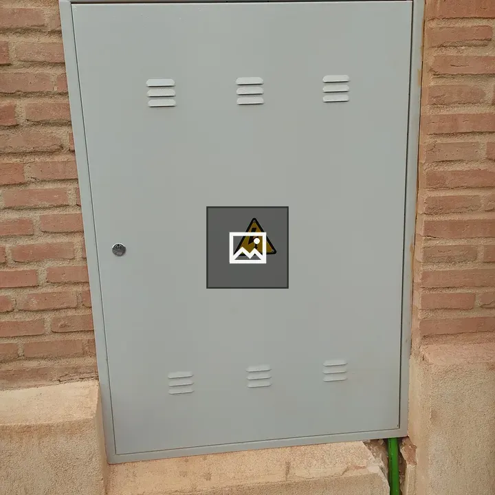 Electrical panel on brick wall