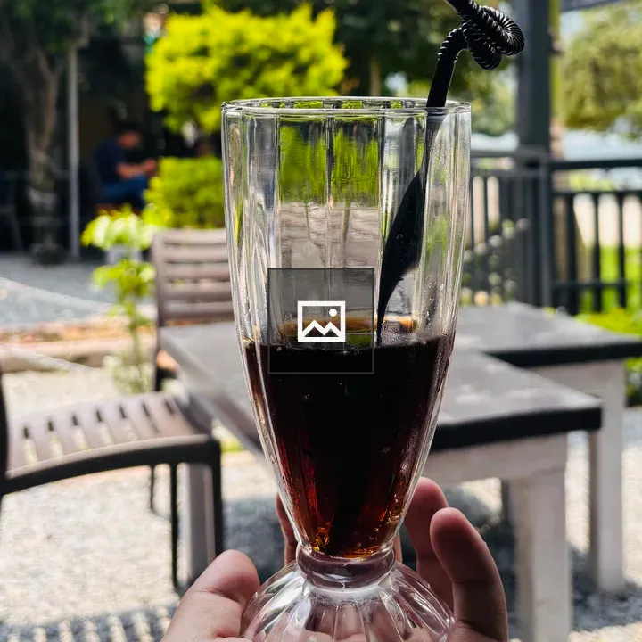 Tall Glass with Dark Beverage