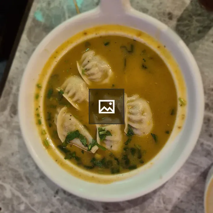 Bowl of soup with dumplings