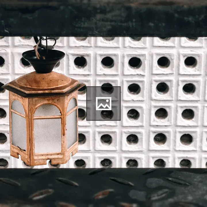 Lamp Against White Latticeback