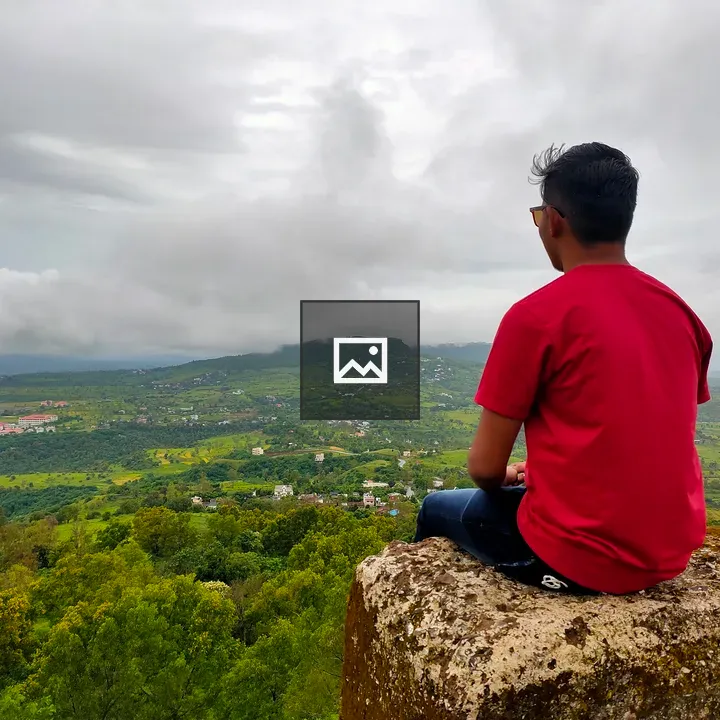 Boy in Nature by the Rock