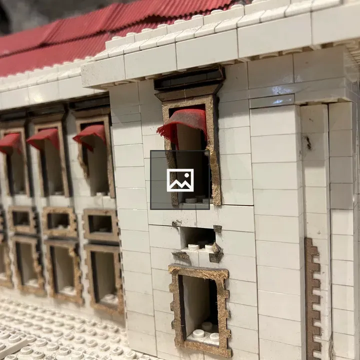 White brick building with red roof