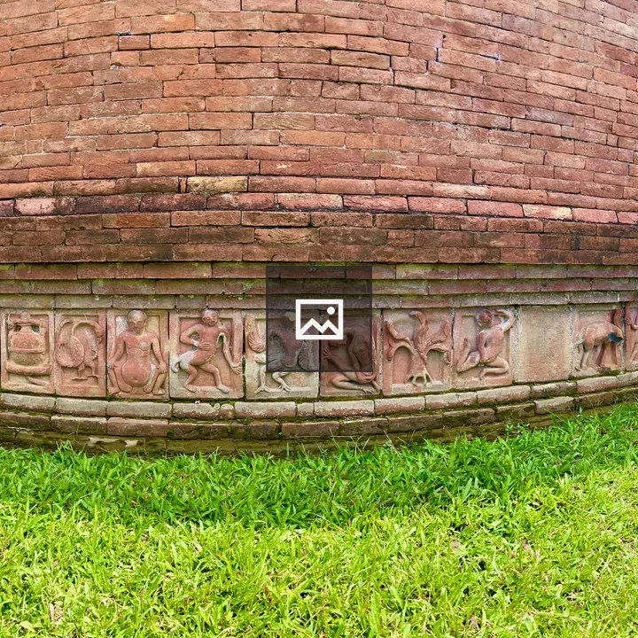 Historical building wall with sculpture tiles