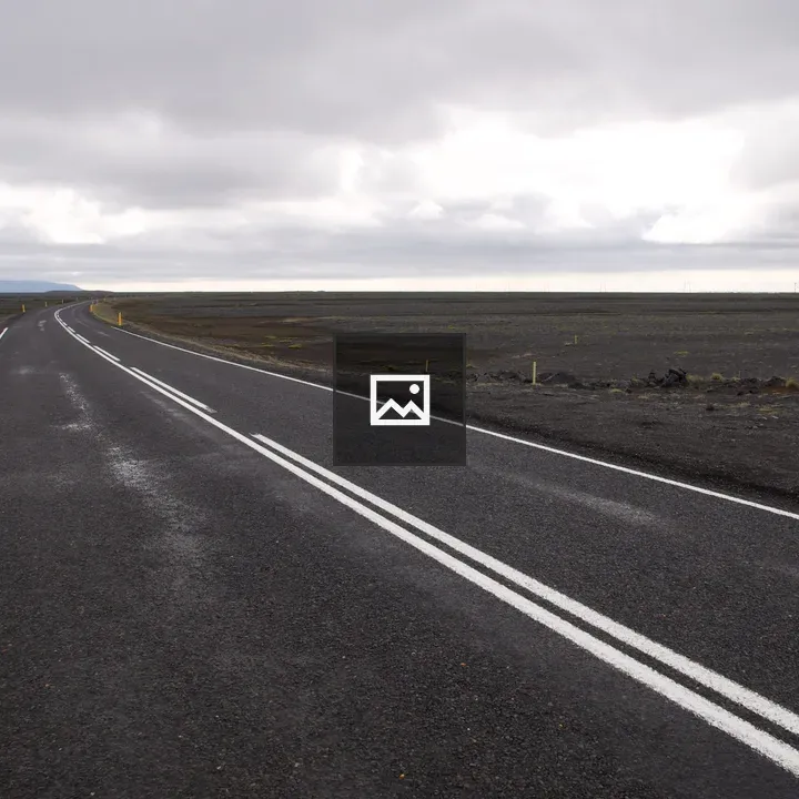 A dark road in Icelandic landscape