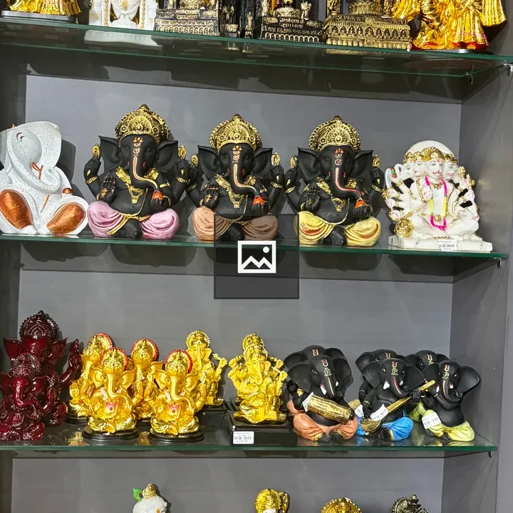 Hindu deity statues on shelves