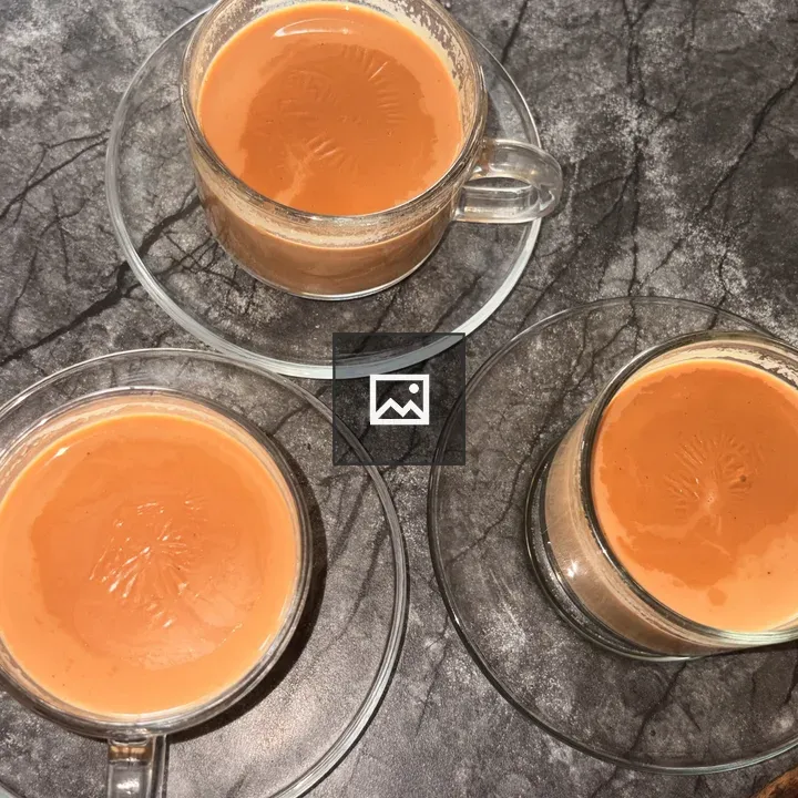 Three cups of tea on table