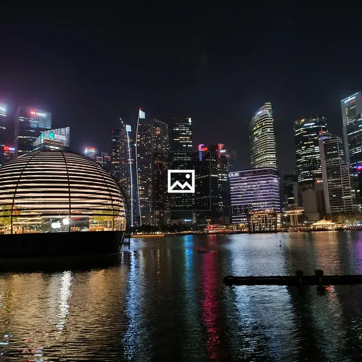 City skyline at night with water