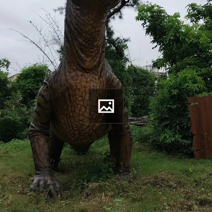 Life-sized dinosaur model in park