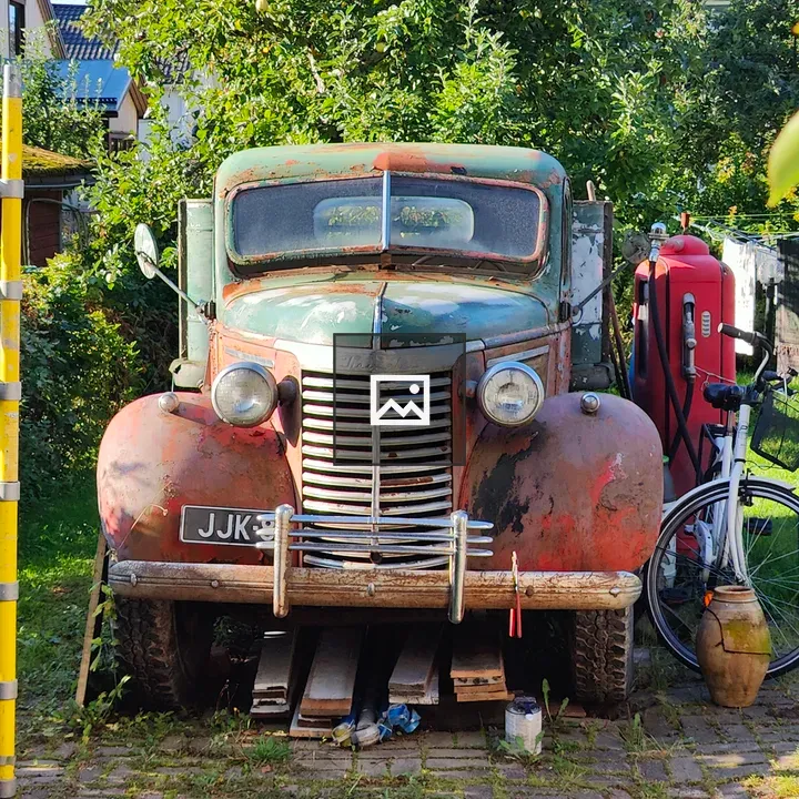 Old rusted truck with bike