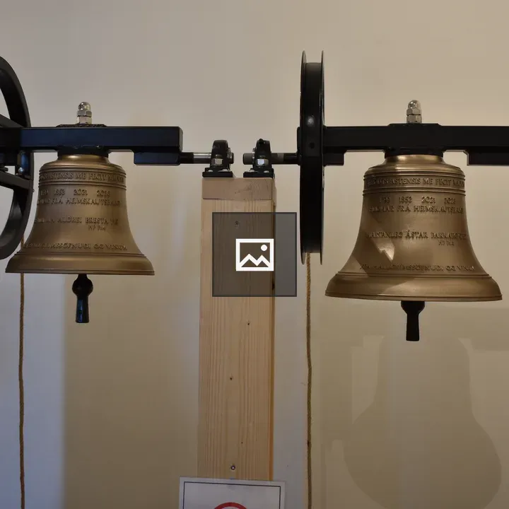 Church bells on wooden posts