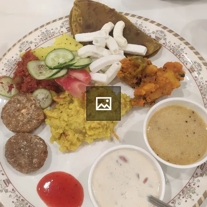 Plate of Indian dishes with sides