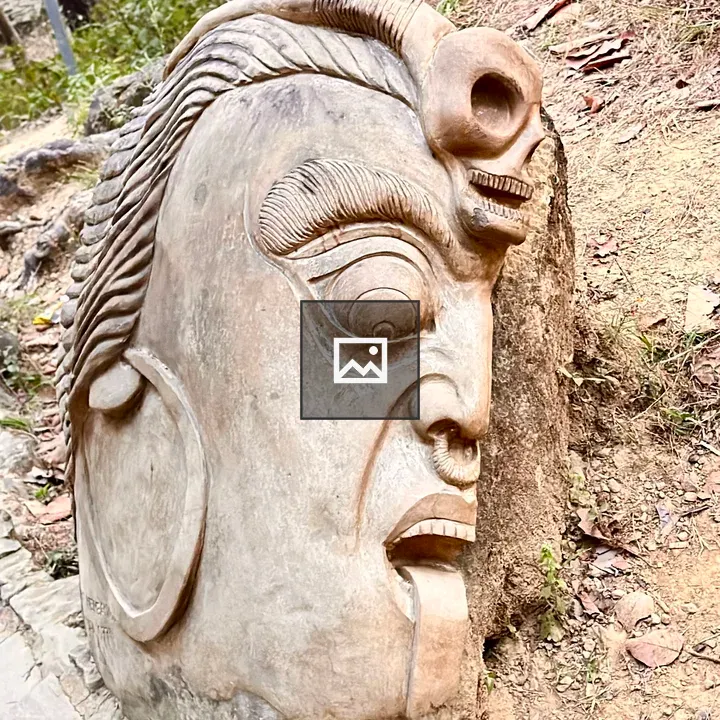 Stone sculpture face carving