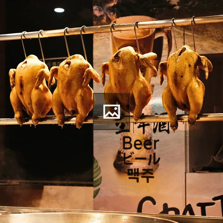 Hanging chickens in marinade