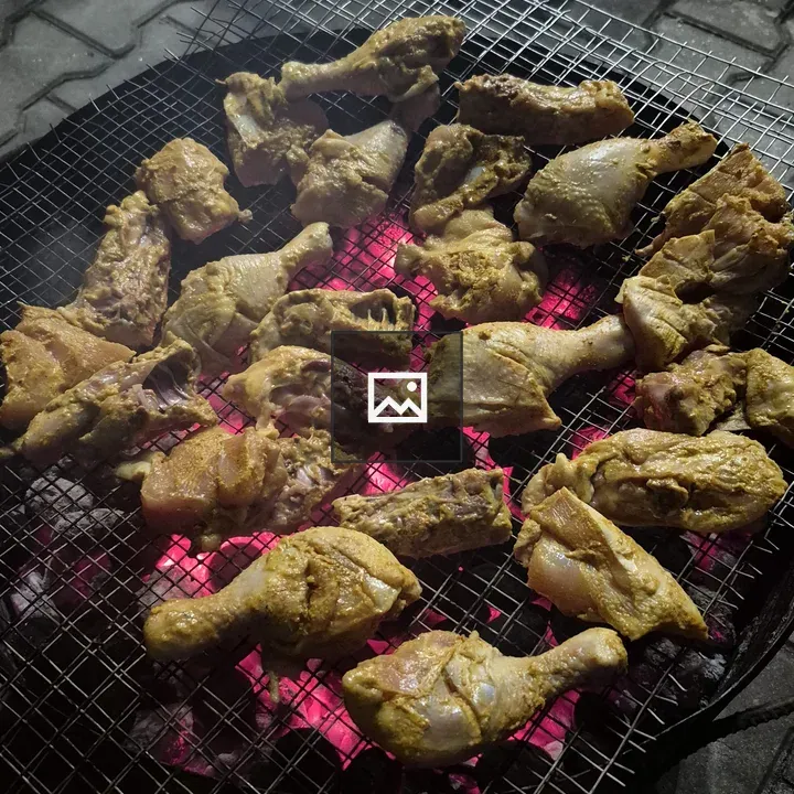 Chicken legs on metal mesh