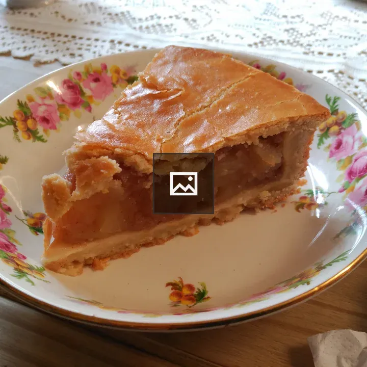 Slice of Apple Pie on Floral Plate
