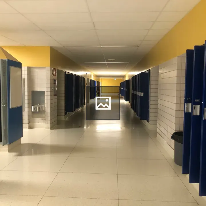Empty School Corridor with Open Lockers