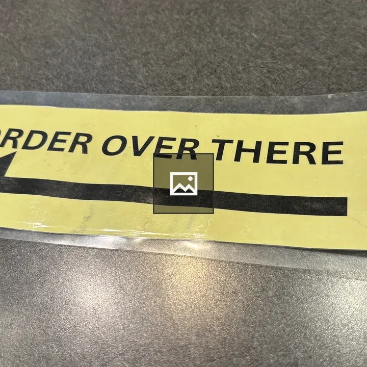 Yellow sign with arrow