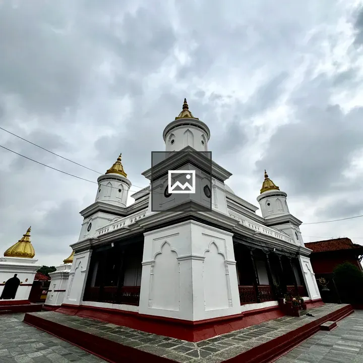 White temple with three golden domes