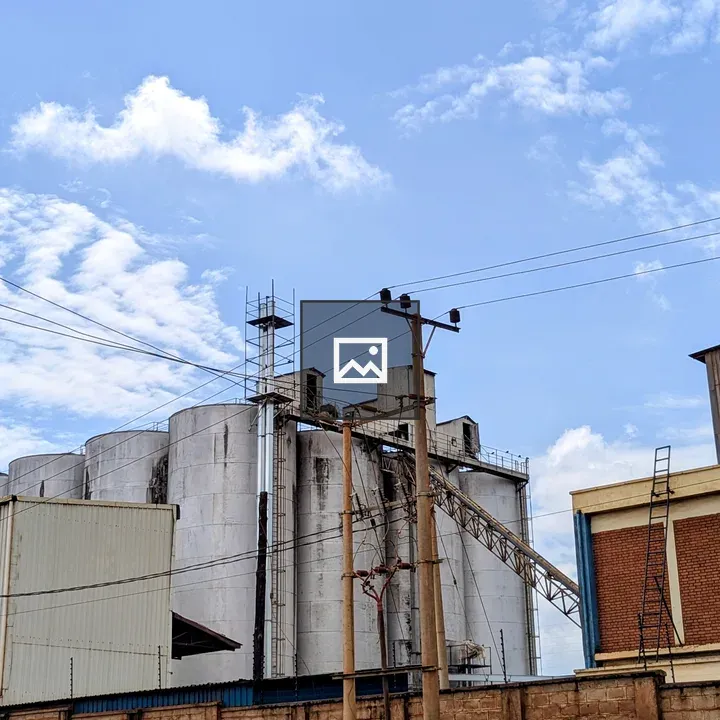 Industrial silo structure against sky