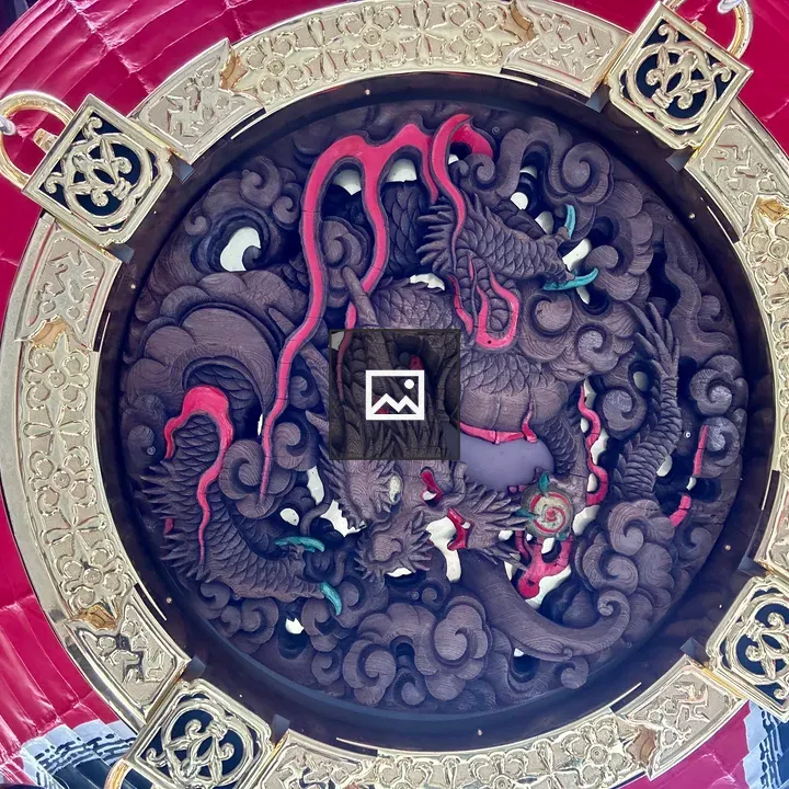Circular wooden panel with intertwined dragons