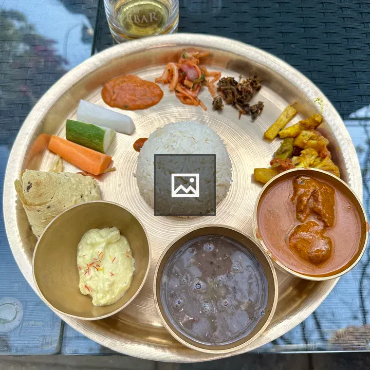 Brass platter with rice and sides