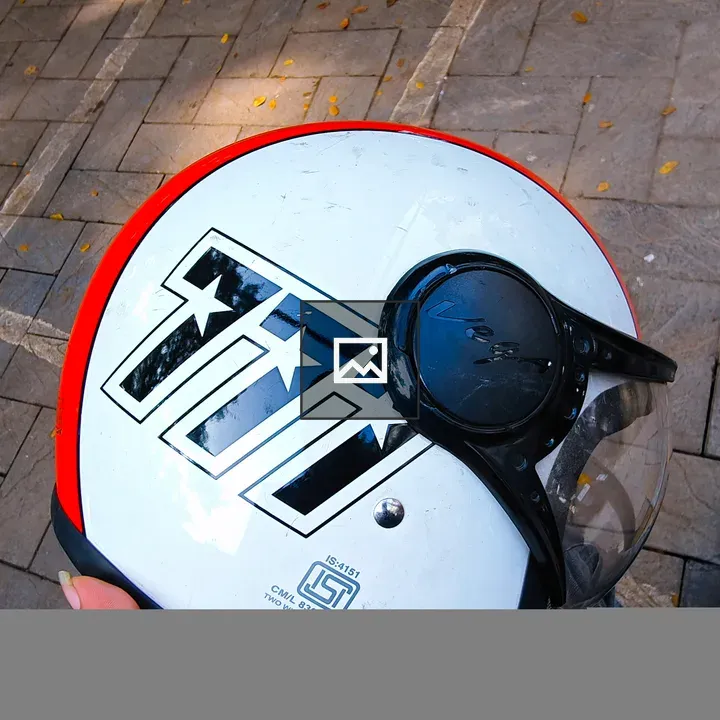 Hand Holding Helmet