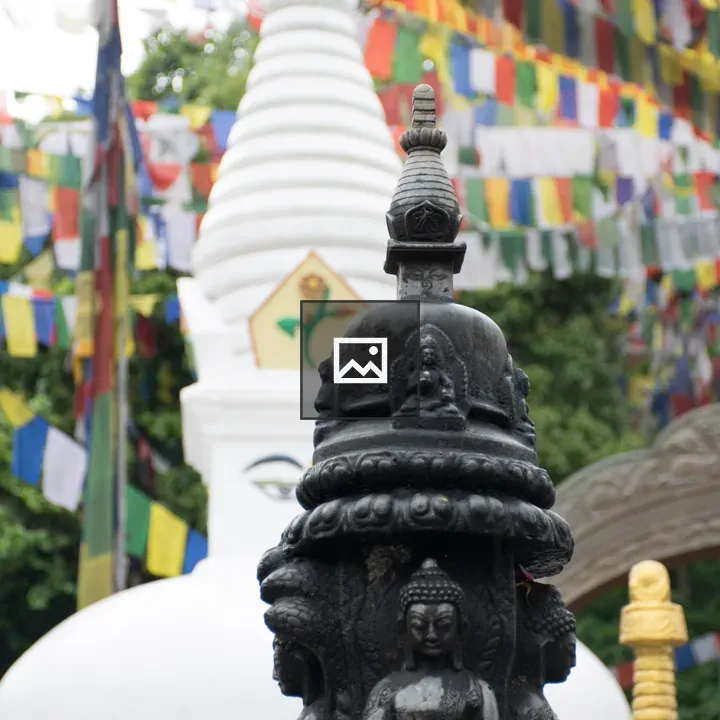 Statues of Buddha with Prayer Flags
