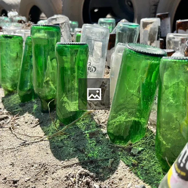 Old glass bottles in dirt