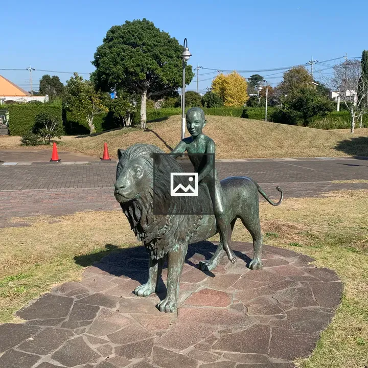 Boy on Lion Bronze Statue