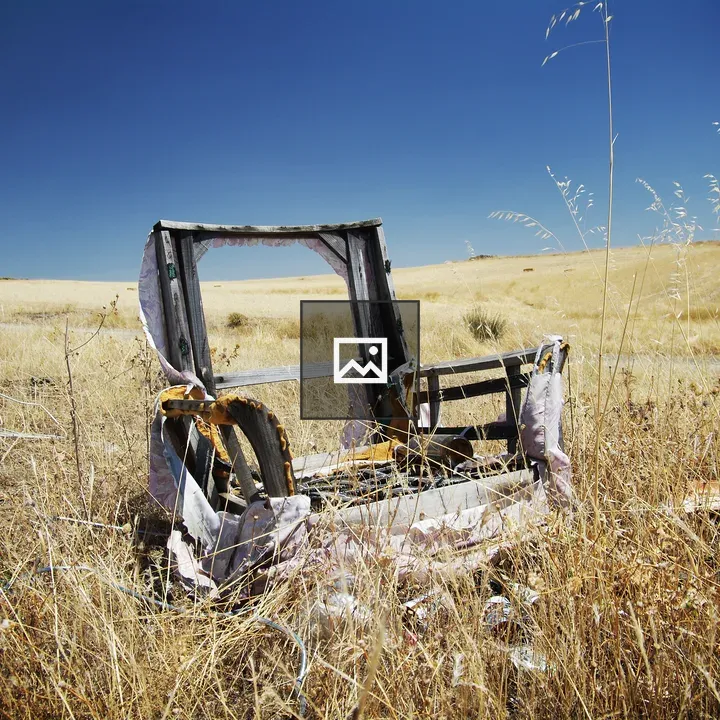 Armchair wreck in countryside