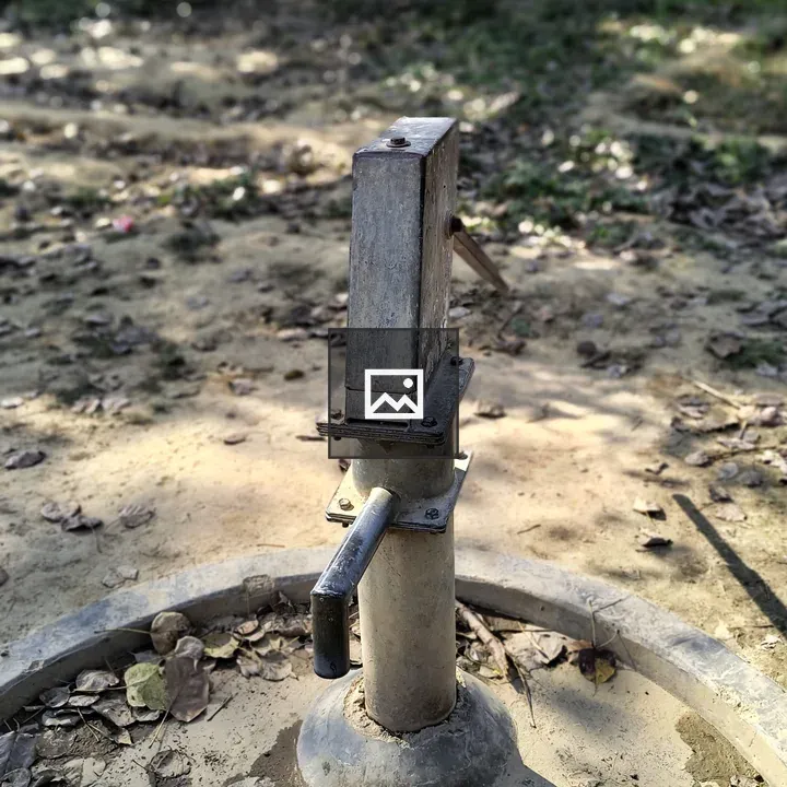 Hand pump in rural setting
