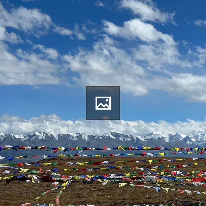 Prayer Flags Over Snow Mountains