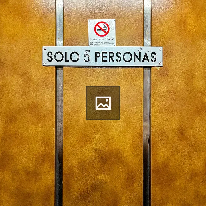 Inside a vintage elevator sign