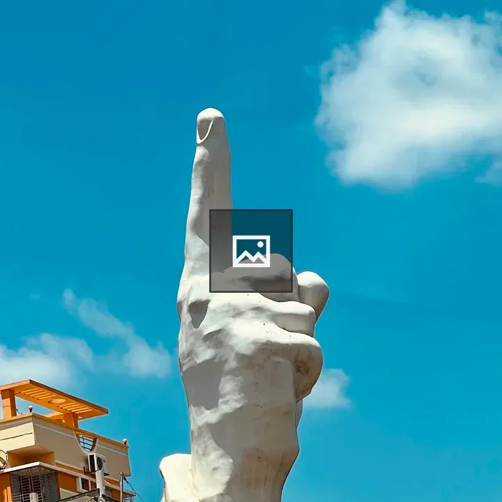 Sculpture of a hand pointing upward