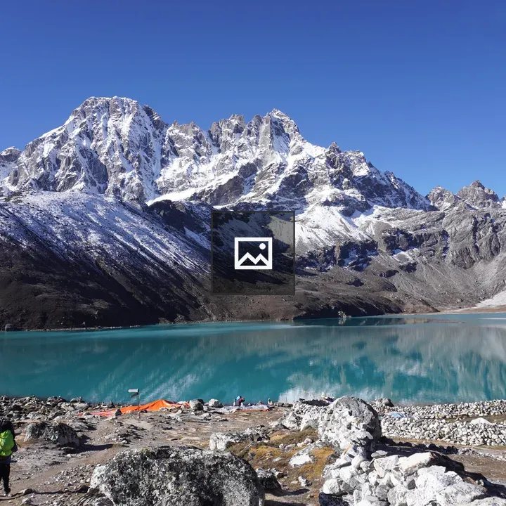 People by Gokyo Lake with Mountain
