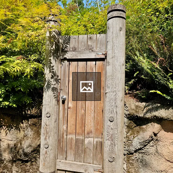 Wooden Gate Between Garden Paths