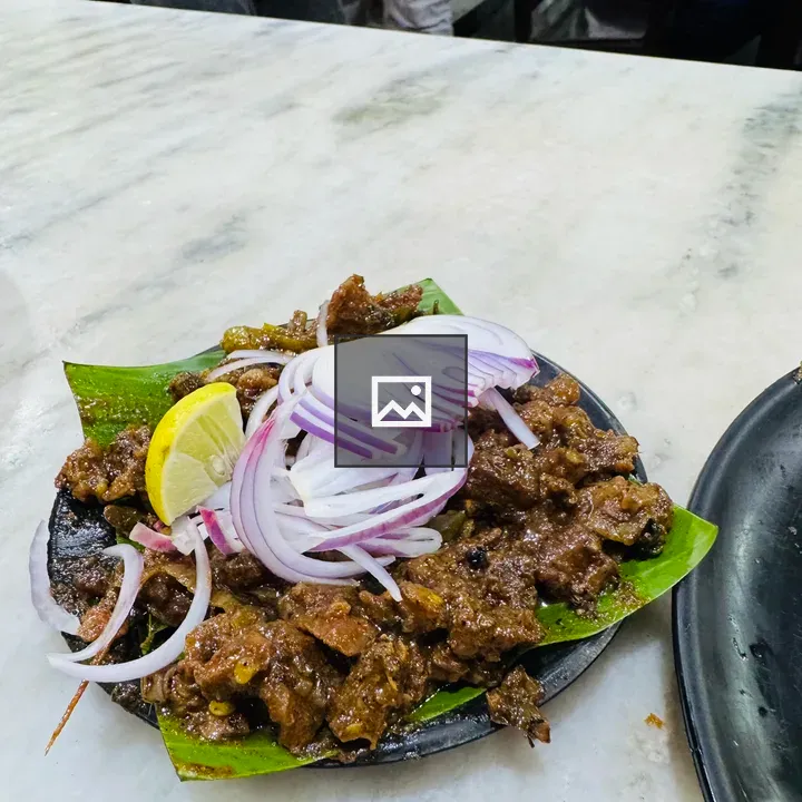 Spiced beef curry on banana leaf