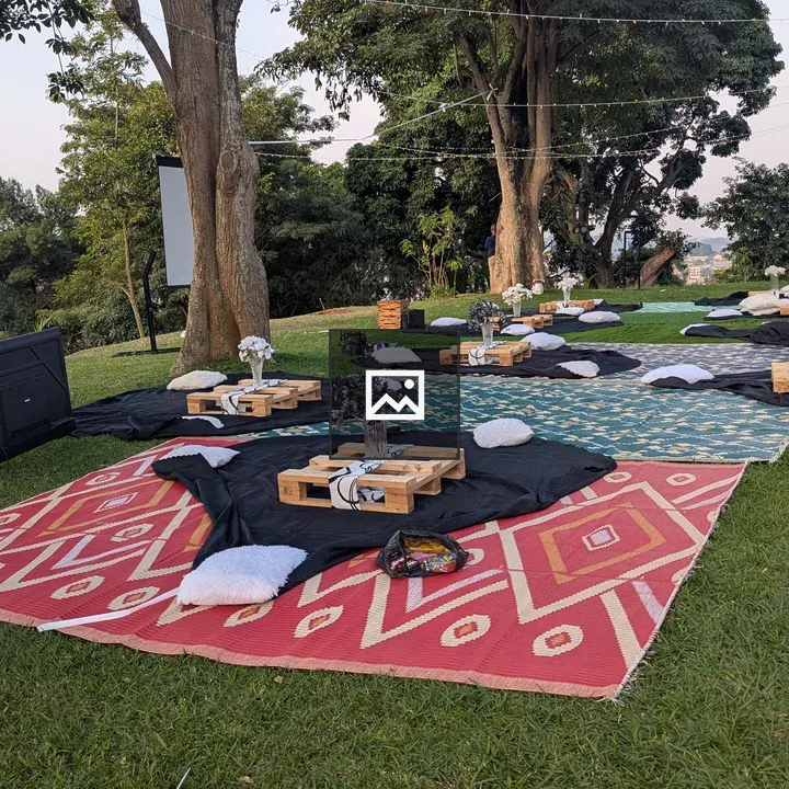 Movie area setup with rugs and cushions