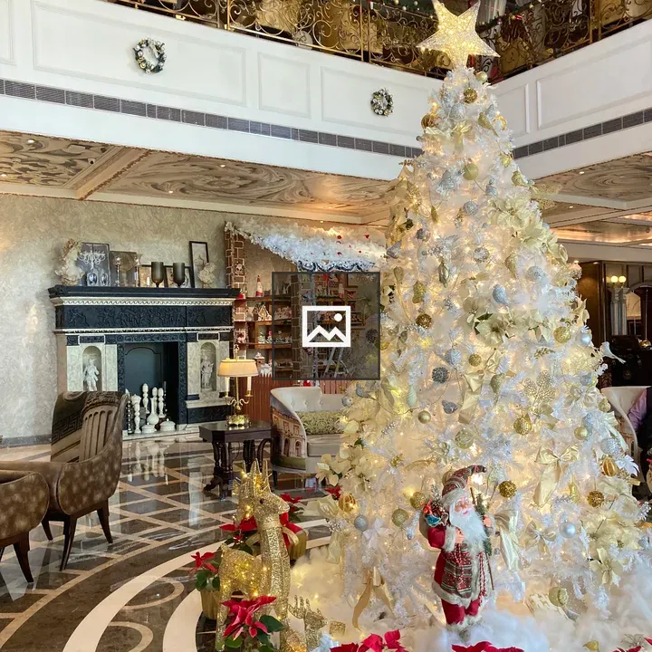 Lobby with large white Christmas tree