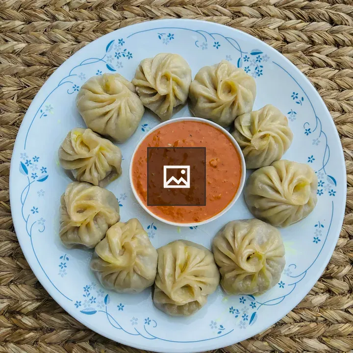 Chicken momo on Nepali mat