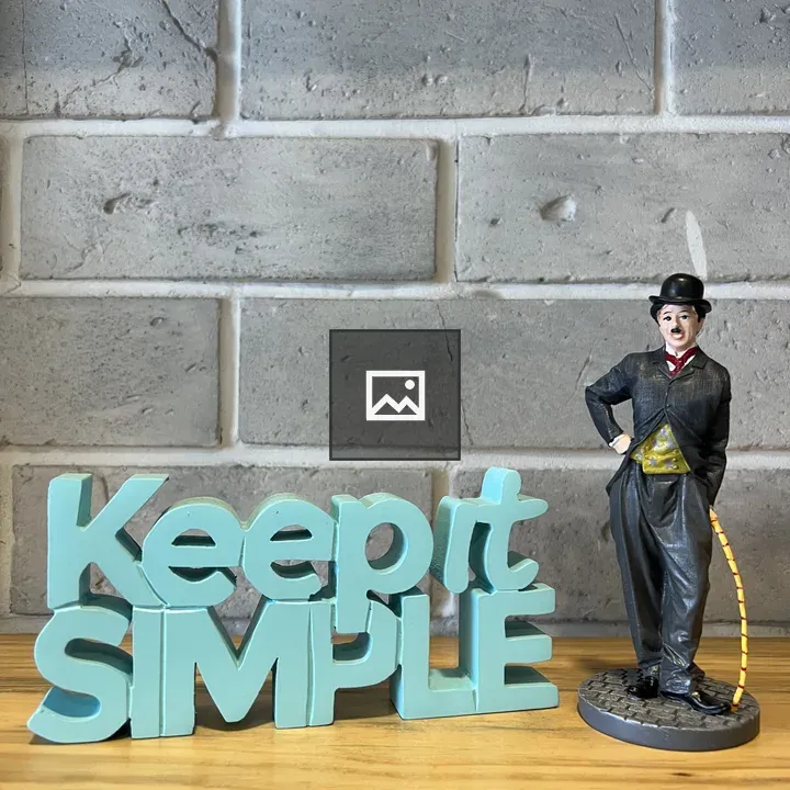 Keep It Simple Wooden Text and Charlie Chaplin Figurine